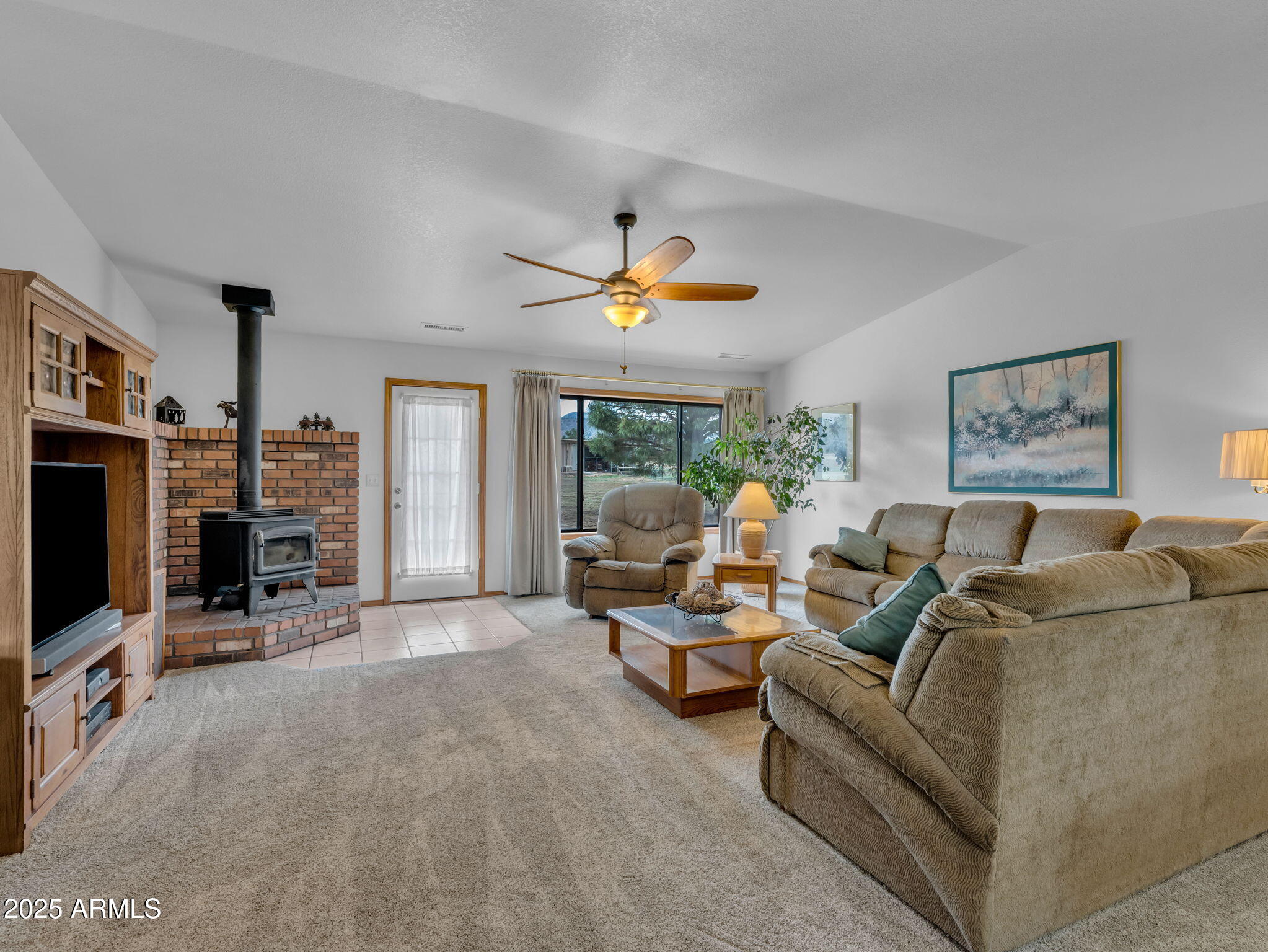 5545 East Atkinson Road Flagstaff, AZ 86004 - Photo 20 of 55 a living room with furniture and a flat screen tv