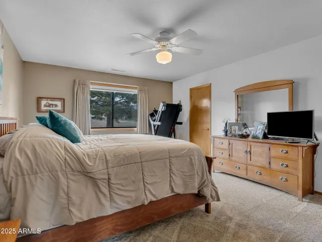 a bathroom with a sink a mirror and a shower