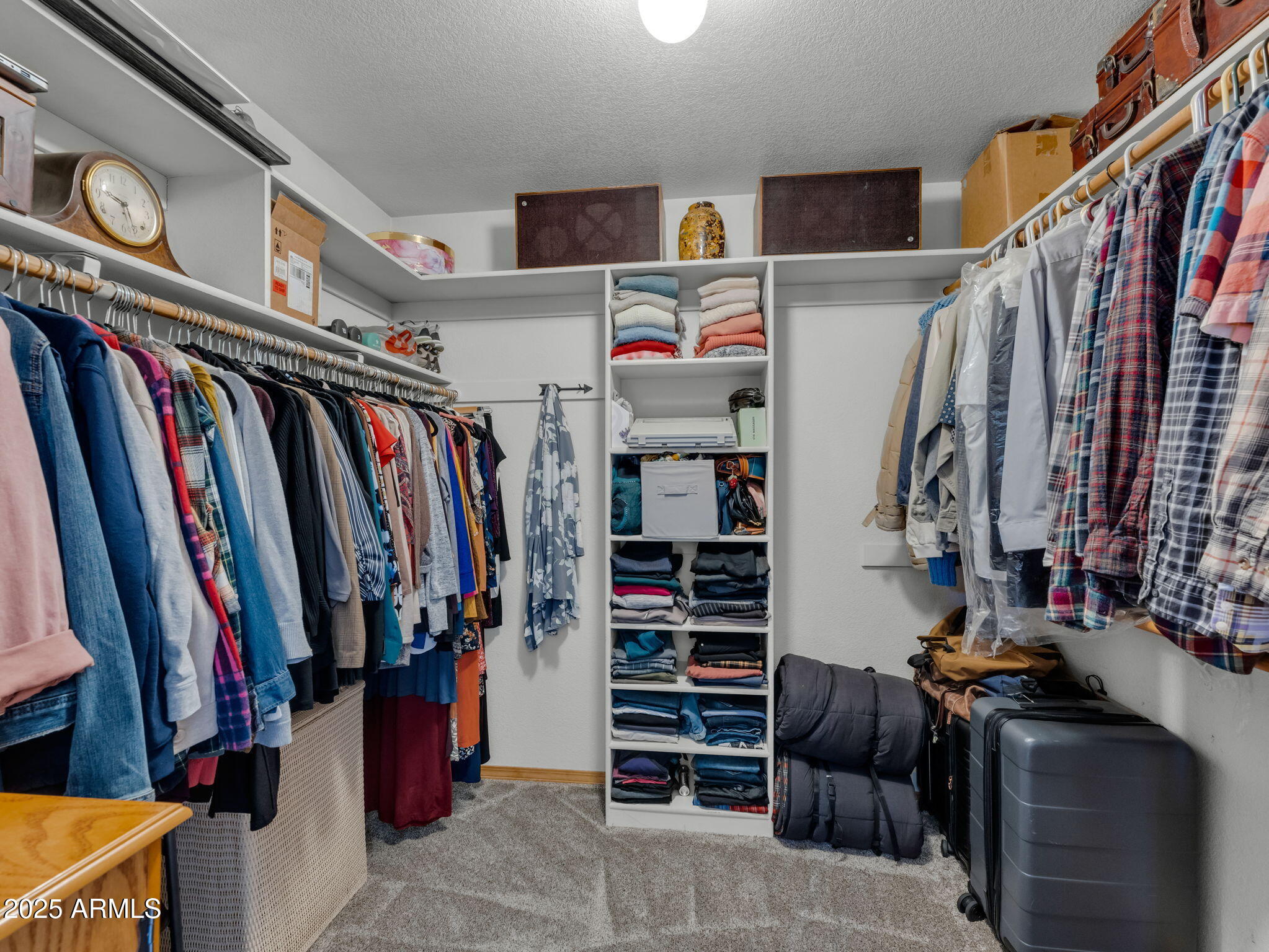 5545 East Atkinson Road Flagstaff, AZ 86004 - Photo 25 of 55 a view of walk in closet with clothes and shoes