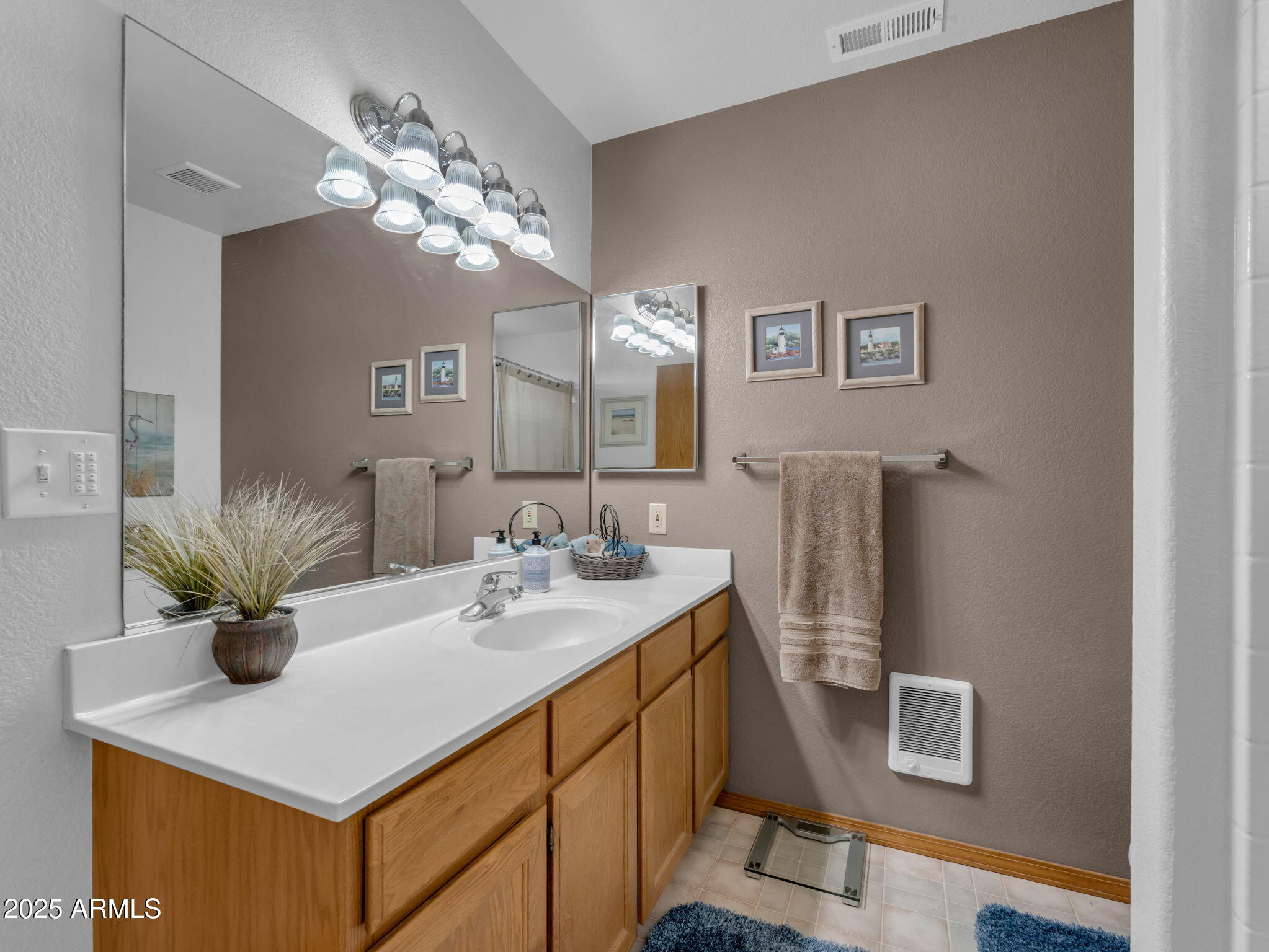5545 East Atkinson Road Flagstaff, AZ 86004 - Photo 26 of 55 a bathroom with a sink a mirror and a shower