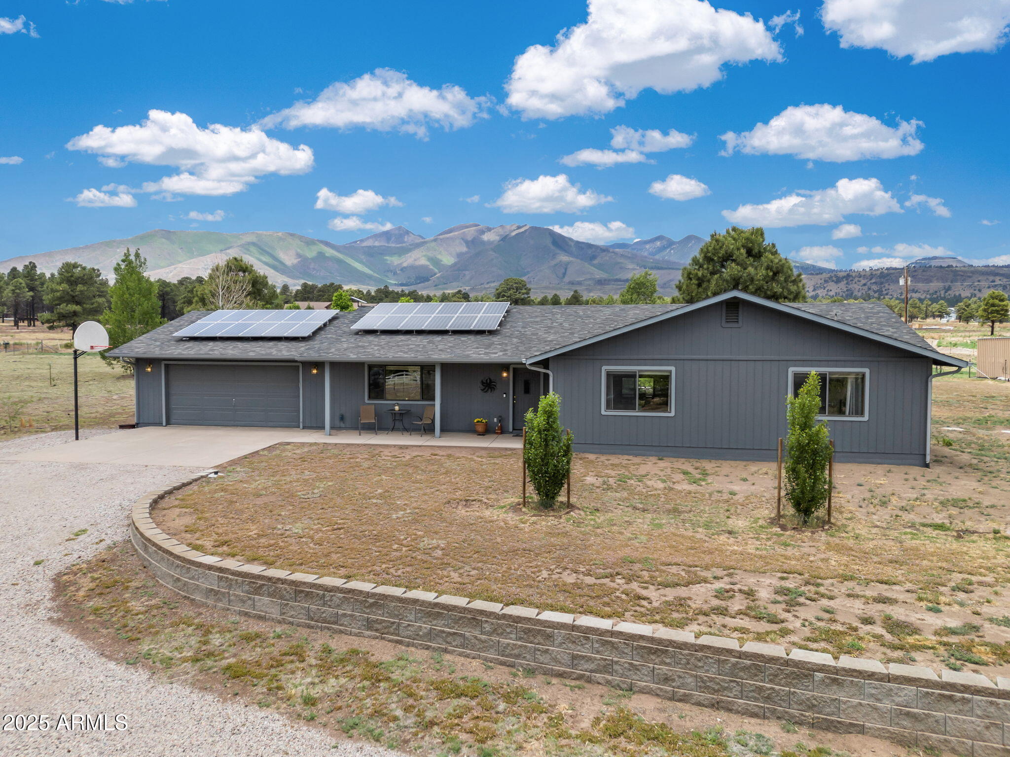 5545 East Atkinson Road Flagstaff, AZ 86004 - Photo 3 of 55 a view of a house with a backyard