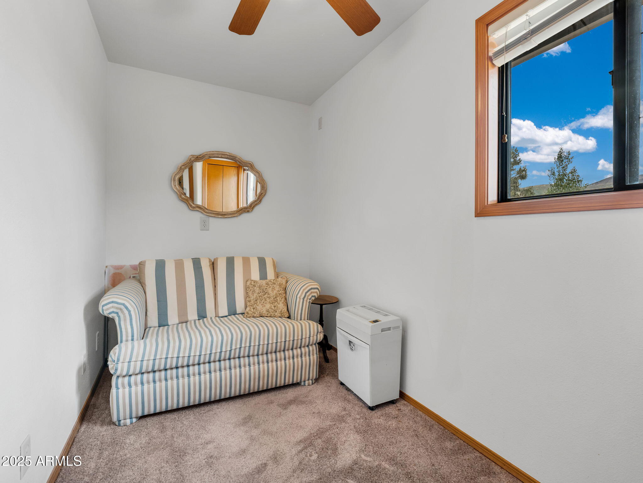 5545 East Atkinson Road Flagstaff, AZ 86004 - Photo 32 of 55 a bedroom with a bed and a painting on the wall