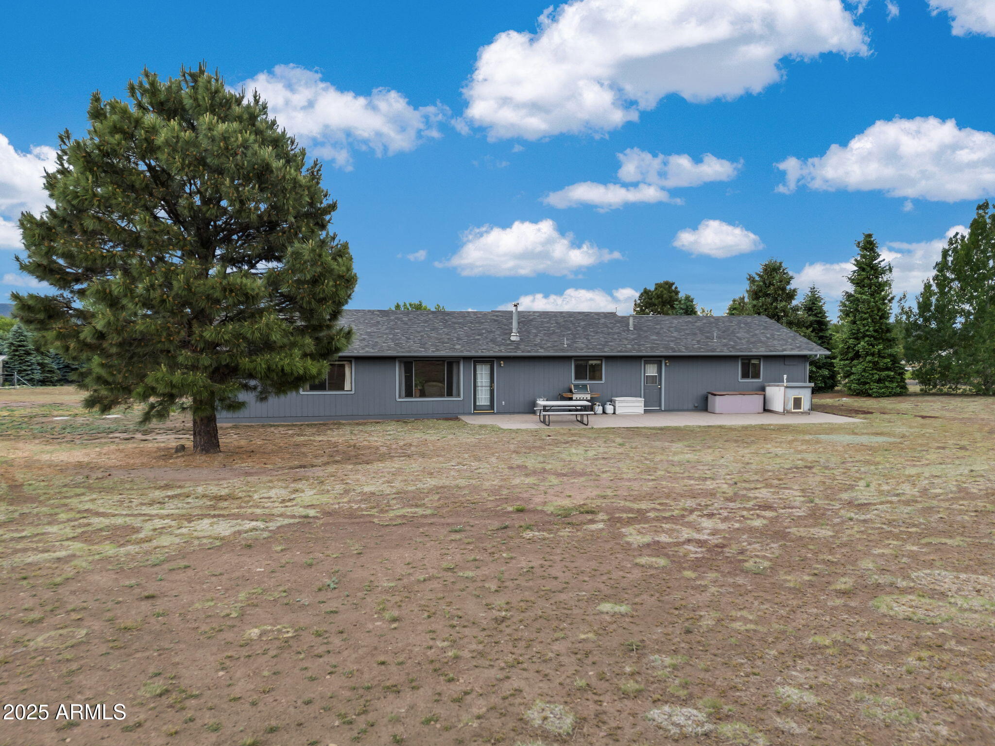 5545 East Atkinson Road Flagstaff, AZ 86004 - Photo 37 of 55 a front view of a house with a yard