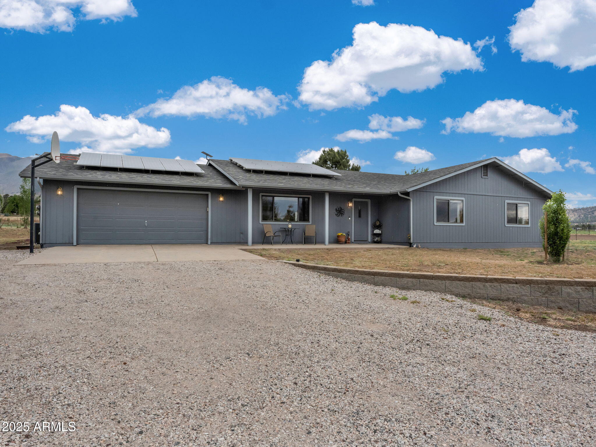 5545 East Atkinson Road Flagstaff, AZ 86004 - Photo 4 of 55 a front view of a house with a yard