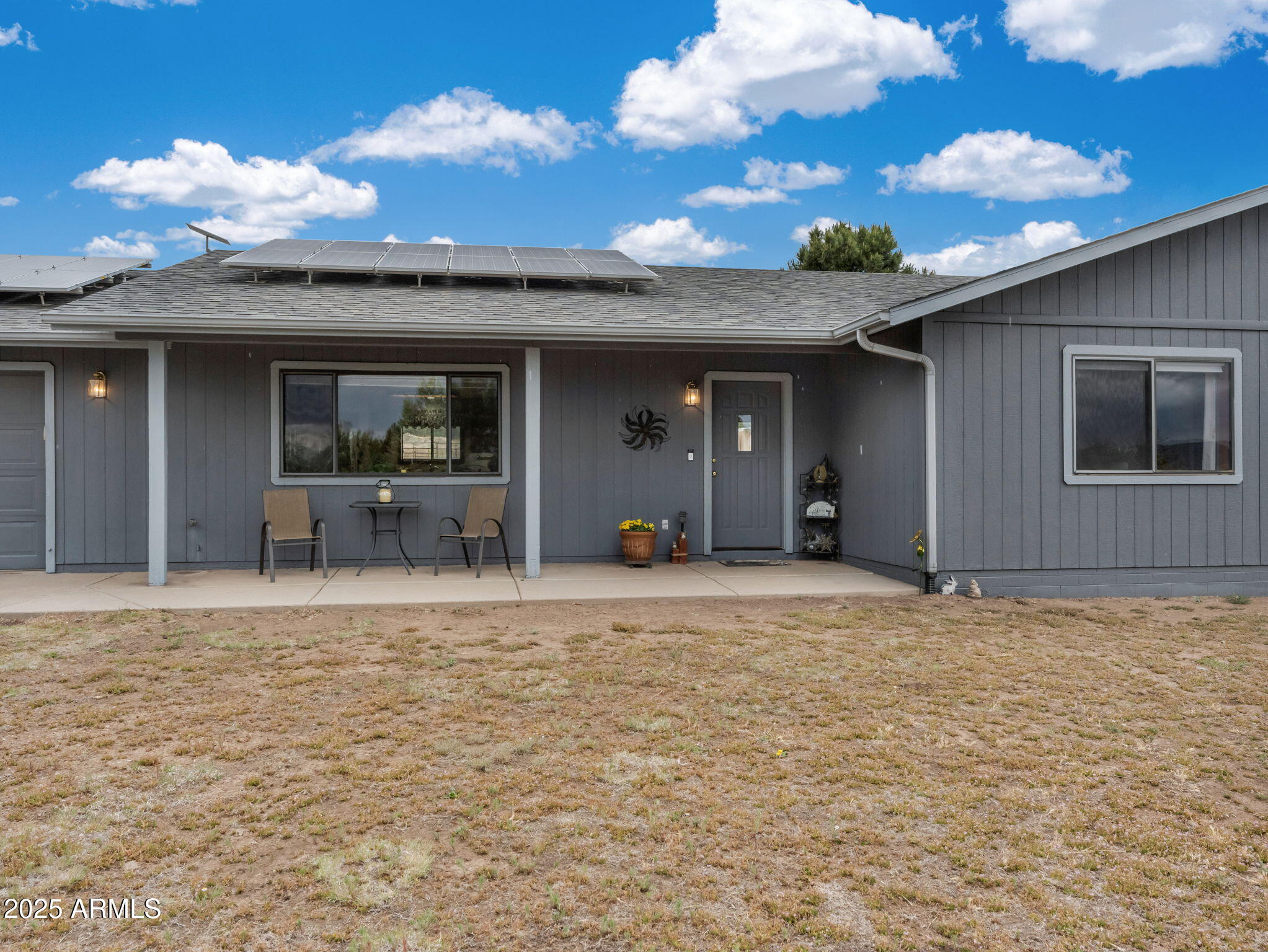 5545 East Atkinson Road Flagstaff, AZ 86004 - Photo 5 of 55 a view of an house with backyard space and a garden
