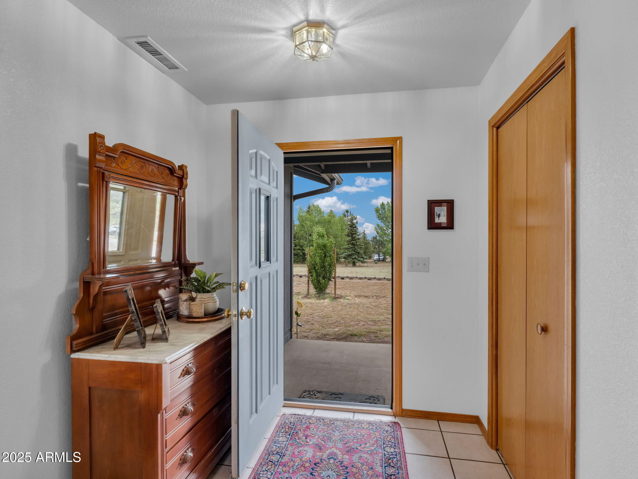 5545 East Atkinson Road Flagstaff, AZ 86004 - Photo 10 of 55 a view of a hallway with bathroom and front door
