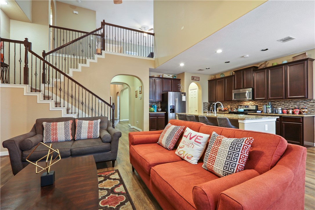 13423 Astley Acres Lane Cypress, TX 77429 - Photo 18 of 39 a living room with furniture kitchen and a wooden floor