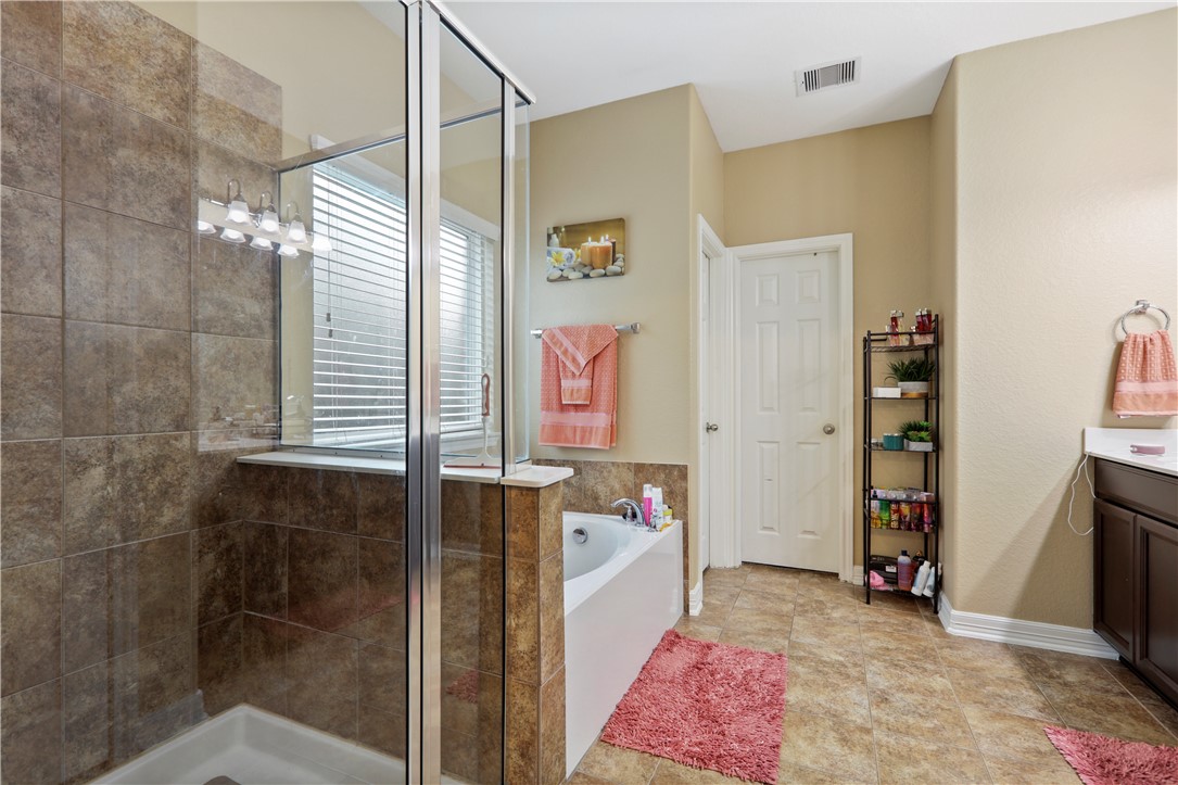 13423 Astley Acres Lane Cypress, TX 77429 - Photo 22 of 39 a bathroom with a sink and a shower