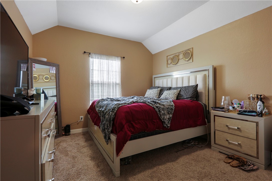 13423 Astley Acres Lane Cypress, TX 77429 - Photo 29 of 39 a bedroom with a bed and dresser