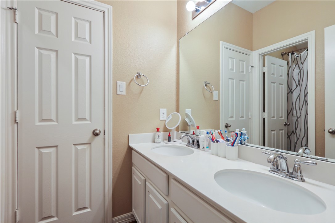 13423 Astley Acres Lane Cypress, TX 77429 - Photo 30 of 39 a bathroom with double vanity sink and a mirror