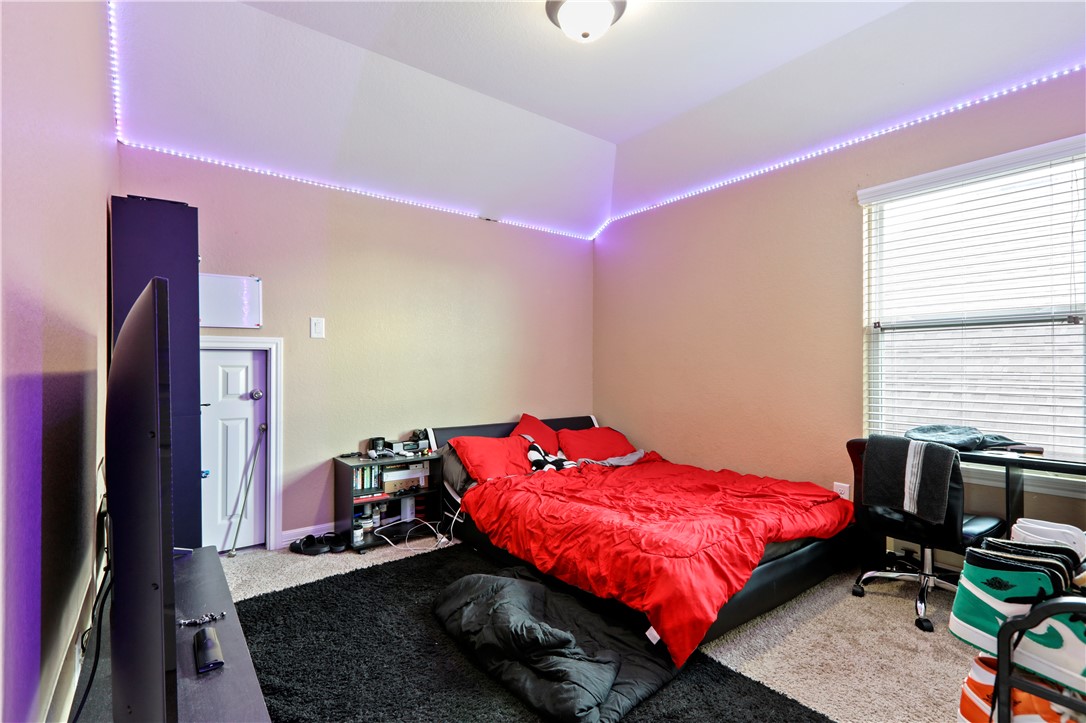 13423 Astley Acres Lane Cypress, TX 77429 - Photo 33 of 39 a bed room with a bed window and a chair