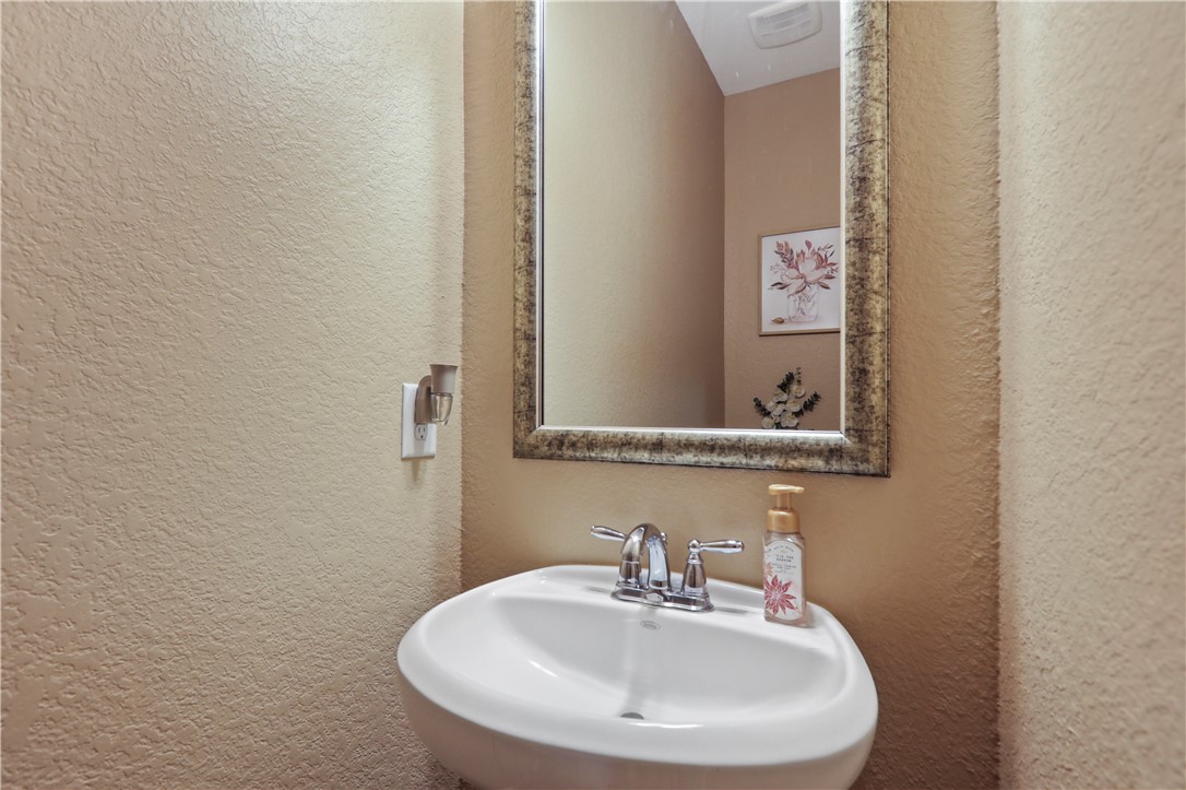 13423 Astley Acres Lane Cypress, TX 77429 - Photo 5 of 39 a bathroom with a sink and a mirror