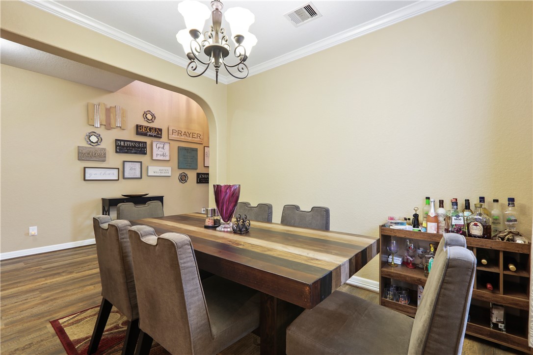 13423 Astley Acres Lane Cypress, TX 77429 - Photo 6 of 39 a view of a dining room with furniture and chandelier