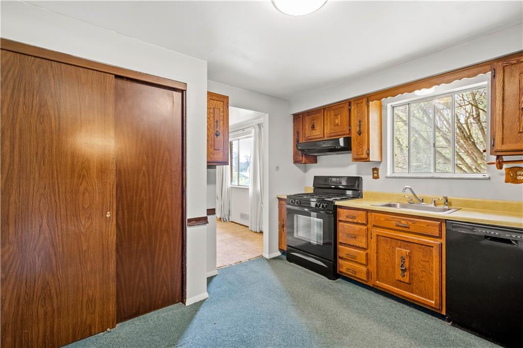 1709 Wilson Road Pittsburgh, PA 15236 - Photo 13 of 25 a kitchen with stainless steel appliances granite countertop a refrigerator and a sink