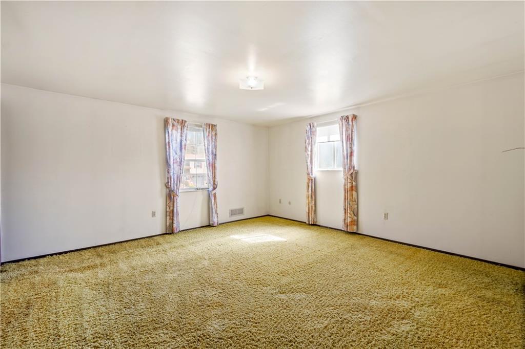 1709 Wilson Road Pittsburgh, PA 15236 - Photo 16 of 25 an empty room with windows