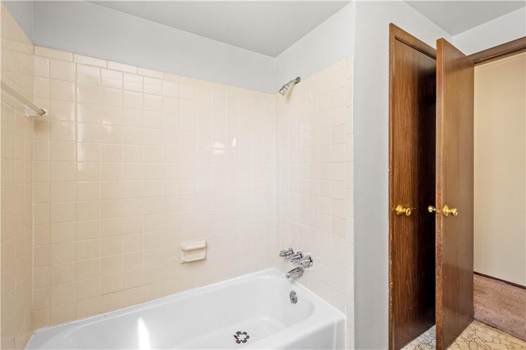 1709 Wilson Road Pittsburgh, PA 15236 - Photo 22 of 25 a bathroom with a bathtub and a shower
