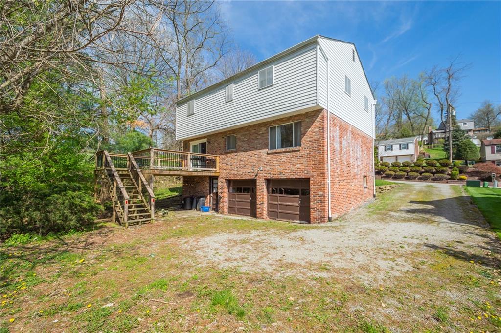 1709 Wilson Road Pittsburgh, PA 15236 - Photo 4 of 25 a view of a house with a yard and sitting area