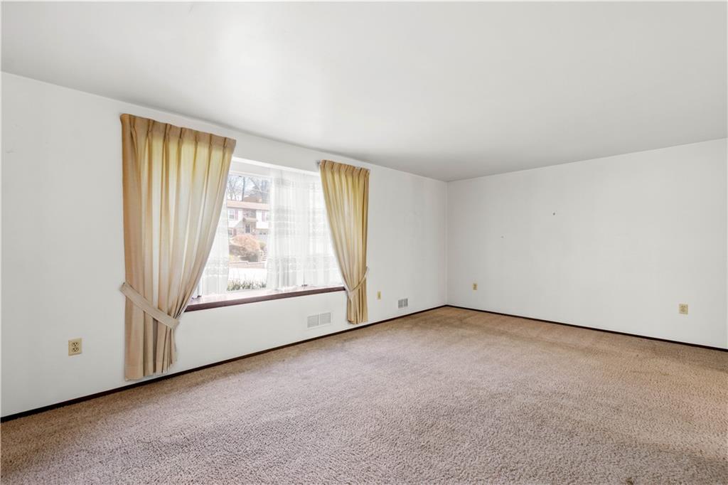 1709 Wilson Road Pittsburgh, PA 15236 - Photo 7 of 25 an empty room with a fireplace