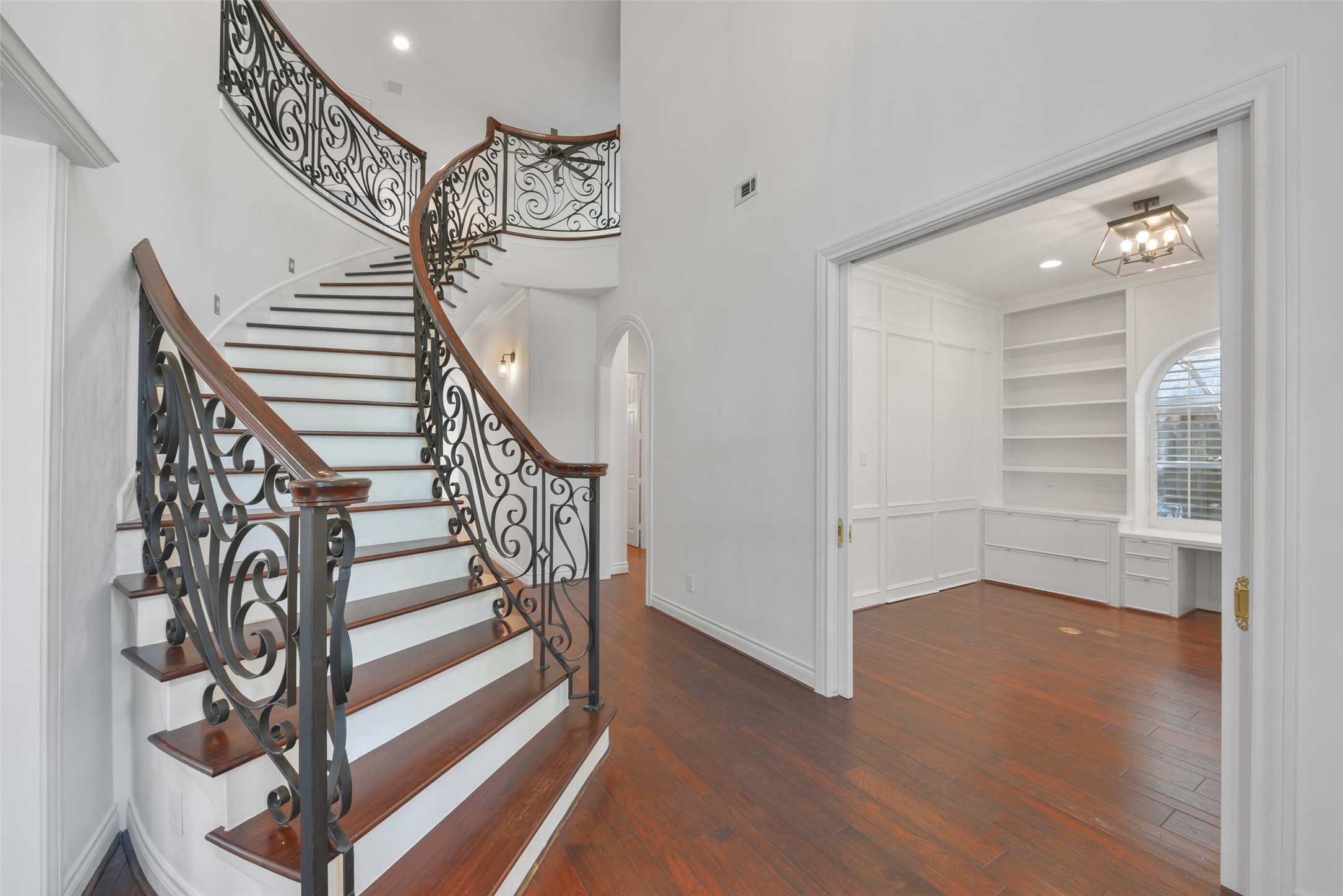 3724 Wroxton Road Houston, TX 77005 - Photo 5 of 40 Entry/foyer looking up the grand staircase and down the front hall. The office is to the right with double pocket doors.