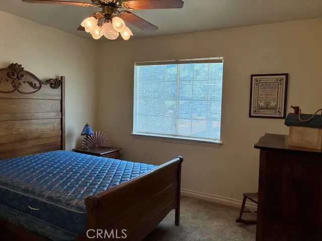 a bedroom with a bed and a table