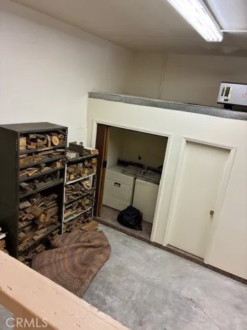 a room with gym equipment and view of living room