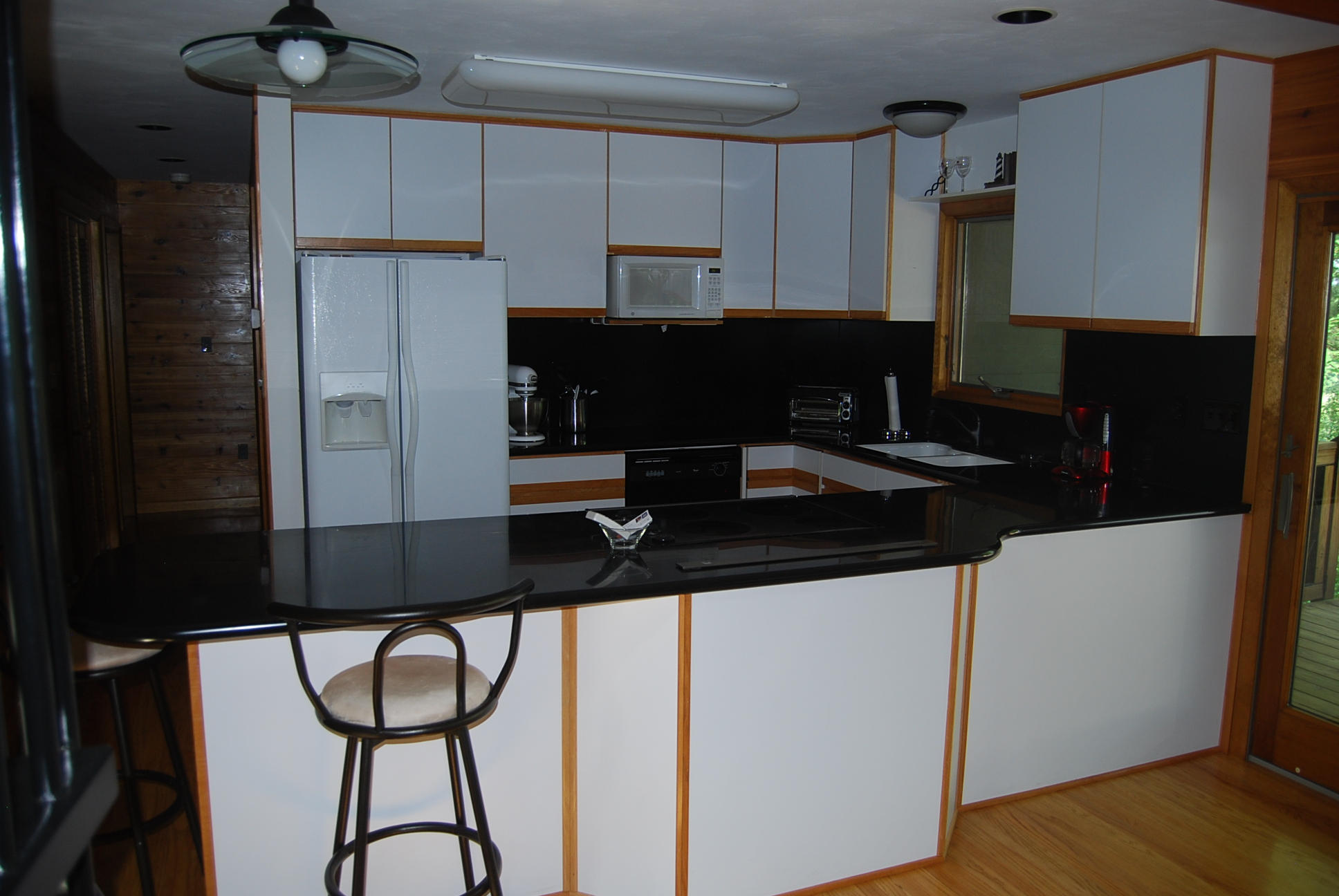 8045 Hardy Road Hardy, VA 24101 - Photo 21 of 63 a kitchen with a sink refrigerator and cabinets