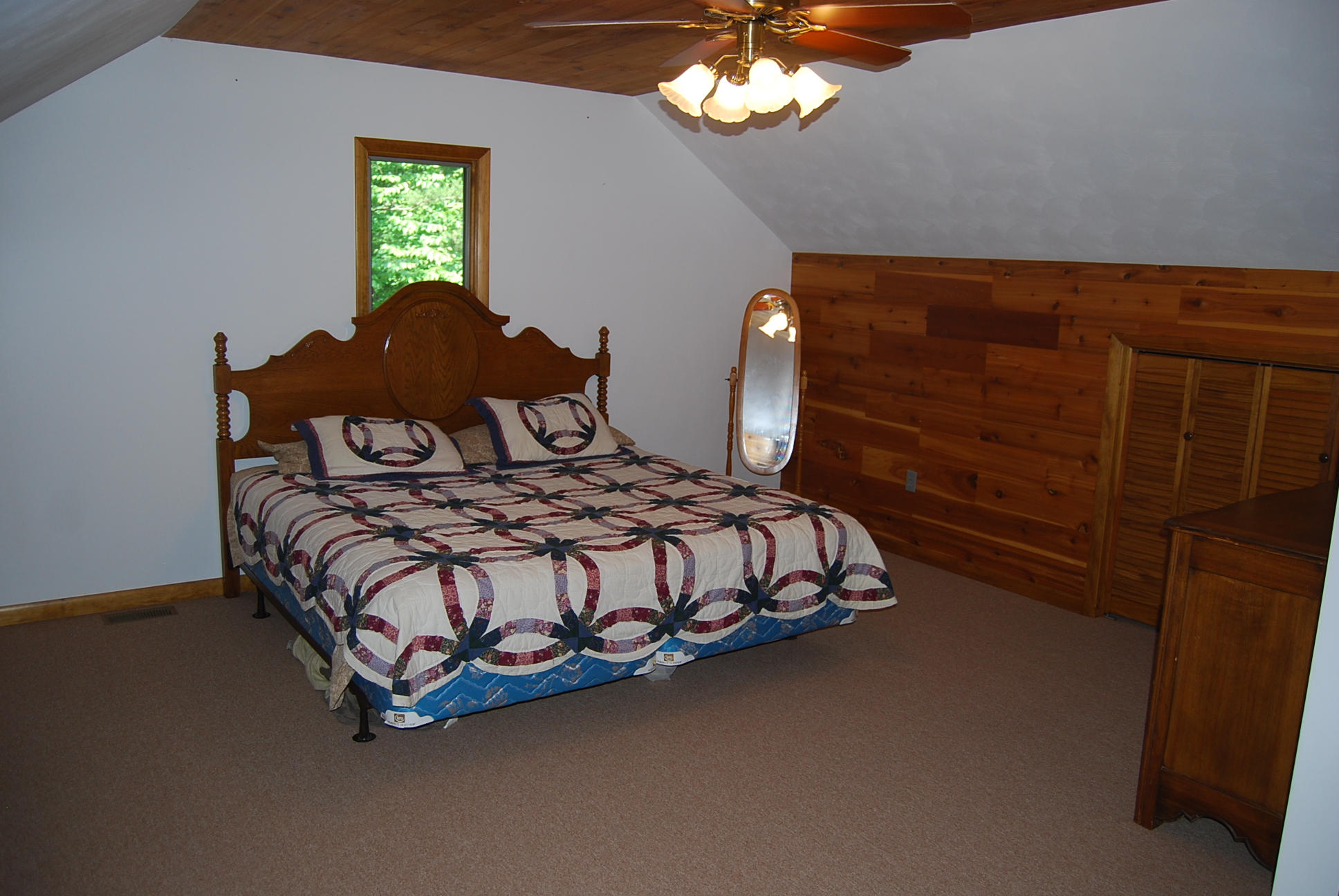 8045 Hardy Road Hardy, VA 24101 - Photo 39 of 63 a bedroom with a bed and a chandelier