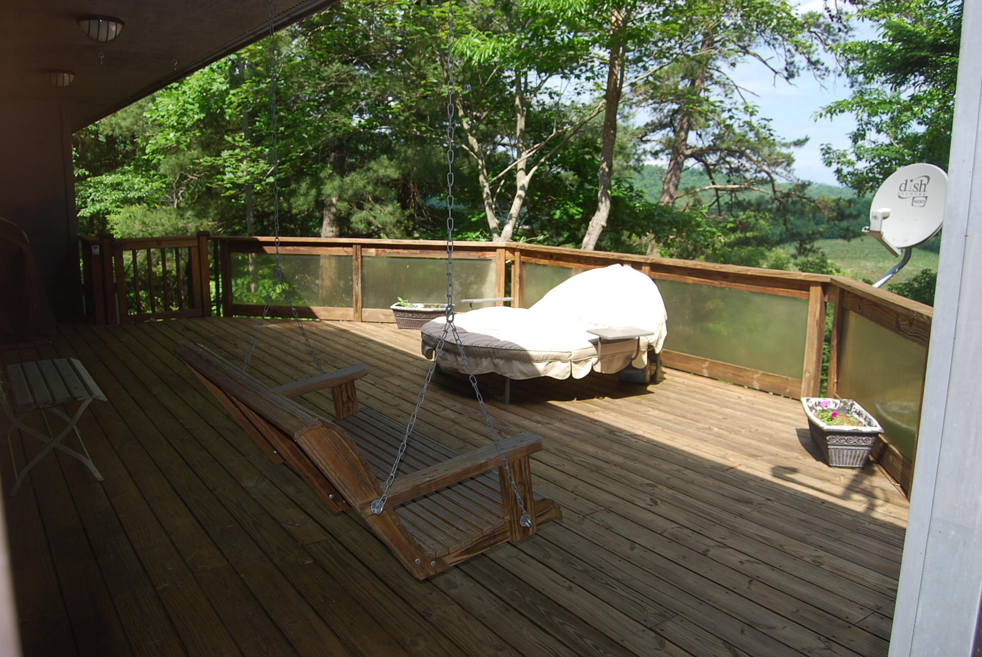 8045 Hardy Road Hardy, VA 24101 - Photo 42 of 63 a view of a balcony with wooden floor and outdoor seating