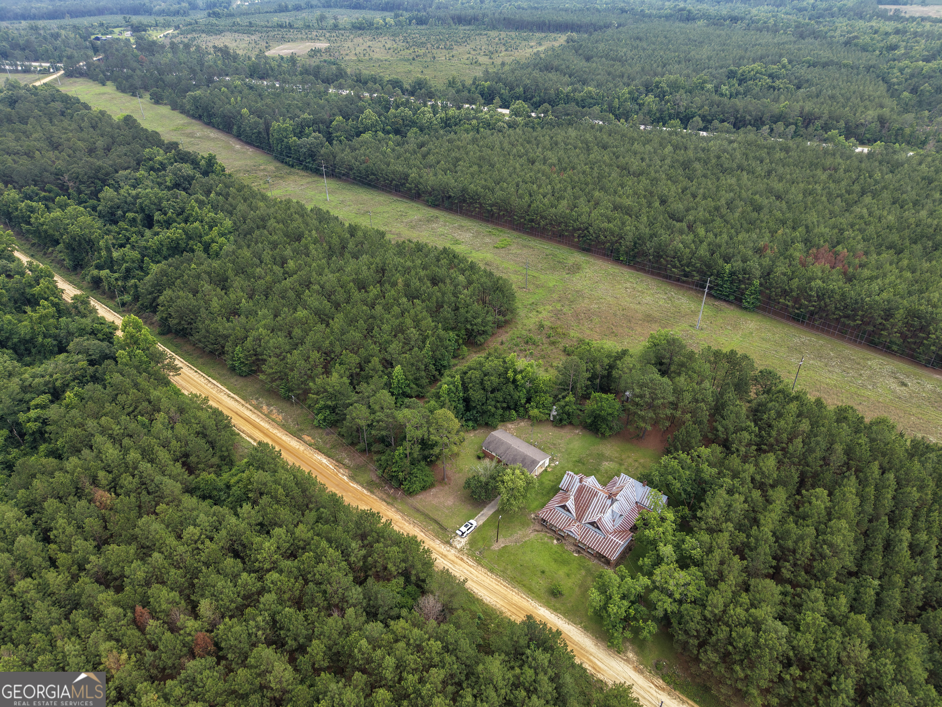 1869 Minter Blue Springs Road Rockledge, GA 30454 - Photo 1 of 45 a view of a lake with a yard