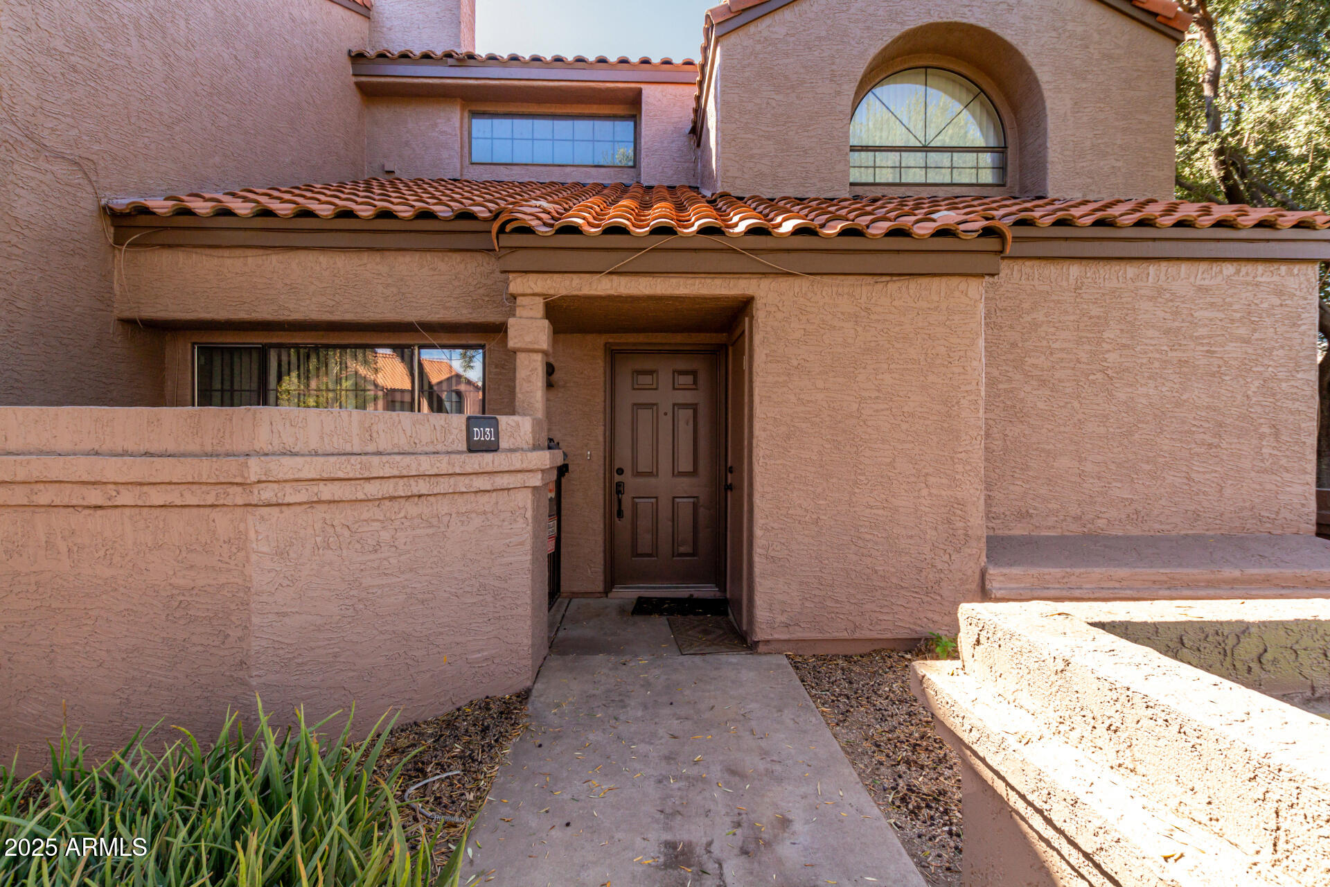 609 East Mesquite Circle, Unit D131 Tempe, AZ 85288 - Photo 1 of 39 a view of a entryway of the house