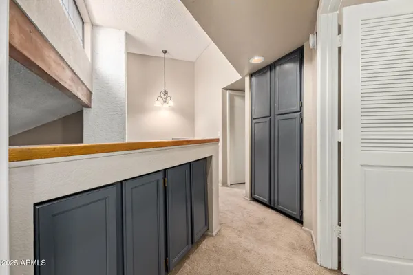 a kitchen with stainless steel appliances a refrigerator and cabinets