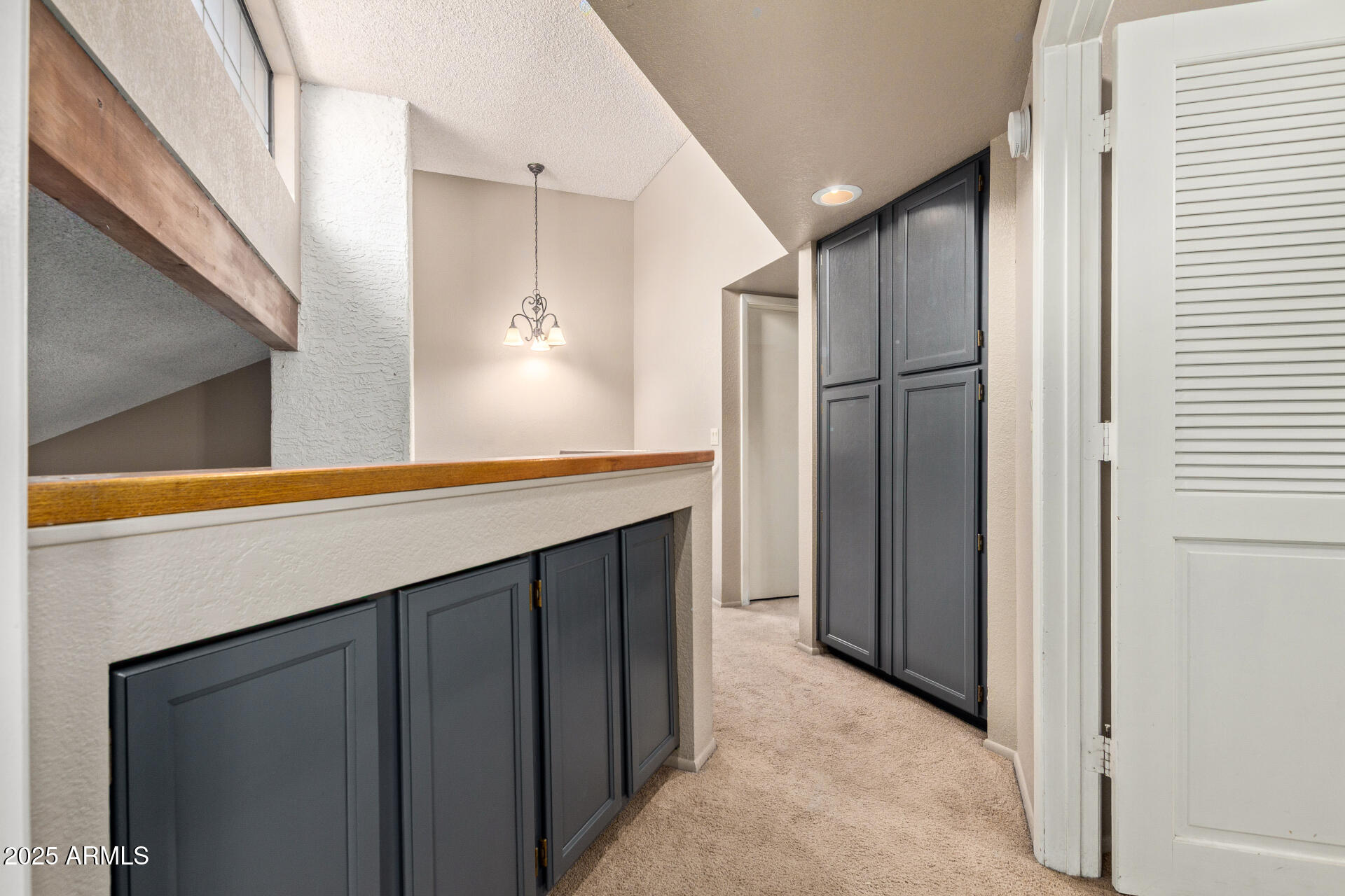 609 East Mesquite Circle, Unit D131 Tempe, AZ 85288 - Photo 12 of 39 a kitchen with stainless steel appliances a refrigerator and cabinets