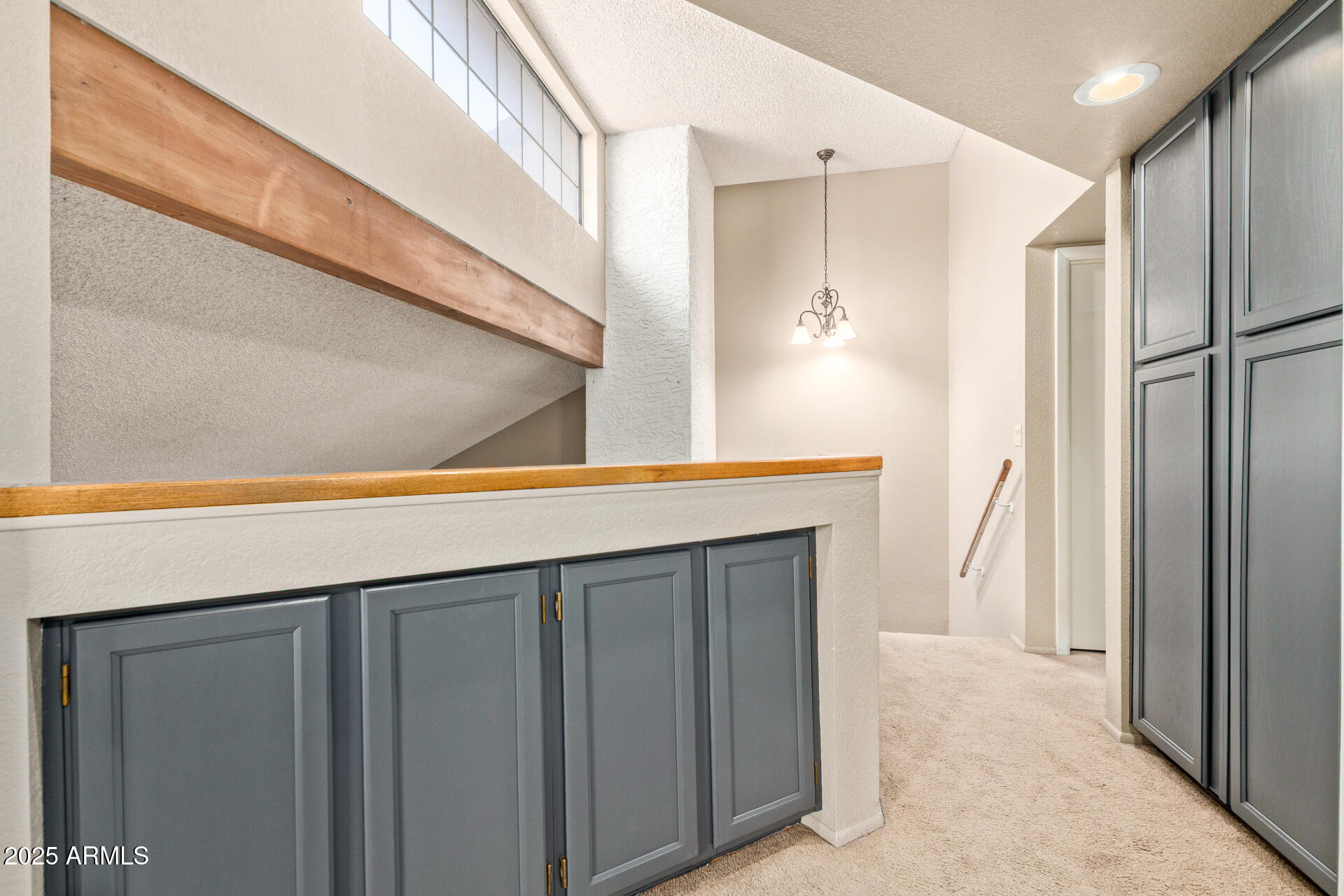 609 East Mesquite Circle, Unit D131 Tempe, AZ 85288 - Photo 13 of 39 a kitchen with a refrigerator and a sink
