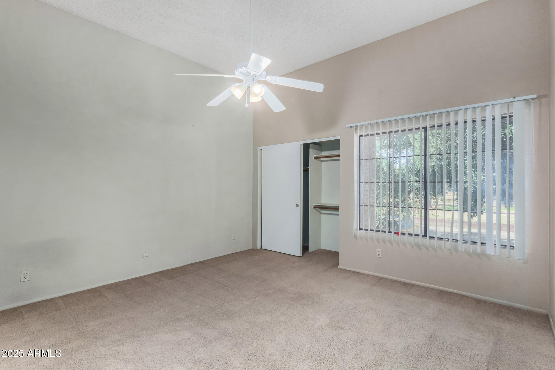 609 East Mesquite Circle, Unit D131 Tempe, AZ 85288 - Photo 14 of 39 a view of an empty room with chandelier fan and fire place