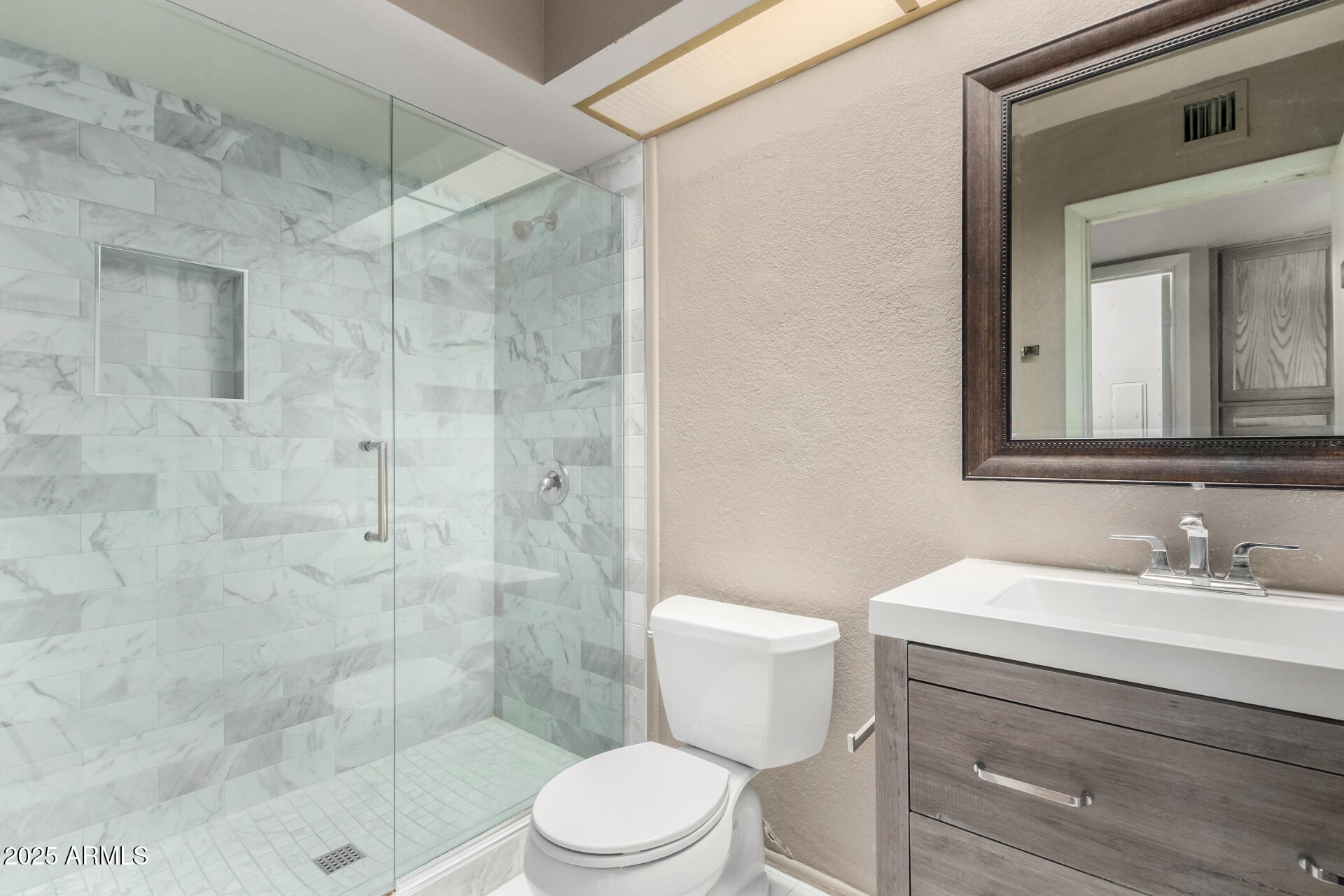 609 East Mesquite Circle, Unit D131 Tempe, AZ 85288 - Photo 18 of 39 a bathroom with a sink a toilet and shower