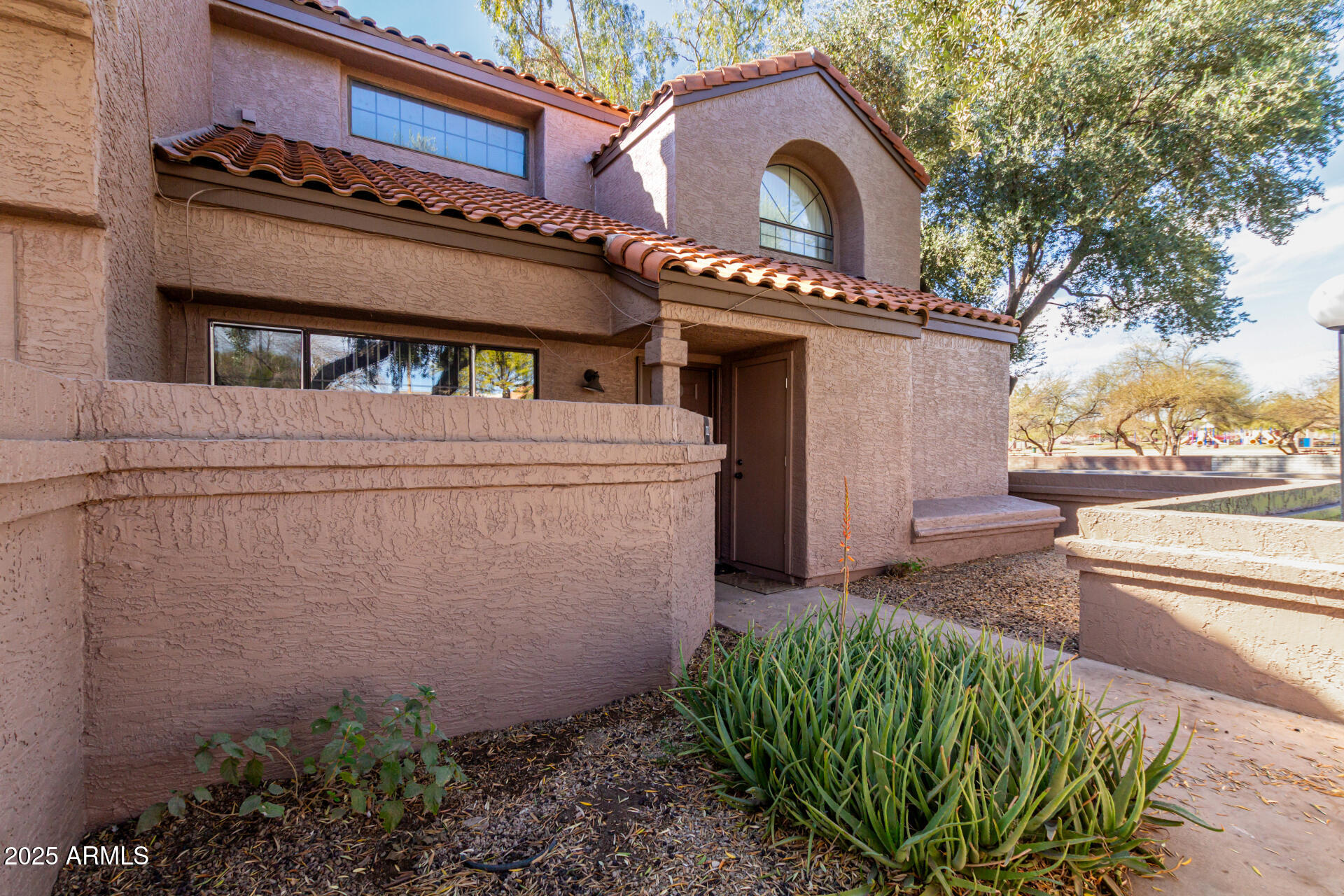 609 East Mesquite Circle, Unit D131 Tempe, AZ 85288 - Photo 2 of 39 a view of a house with a tub and covered walls