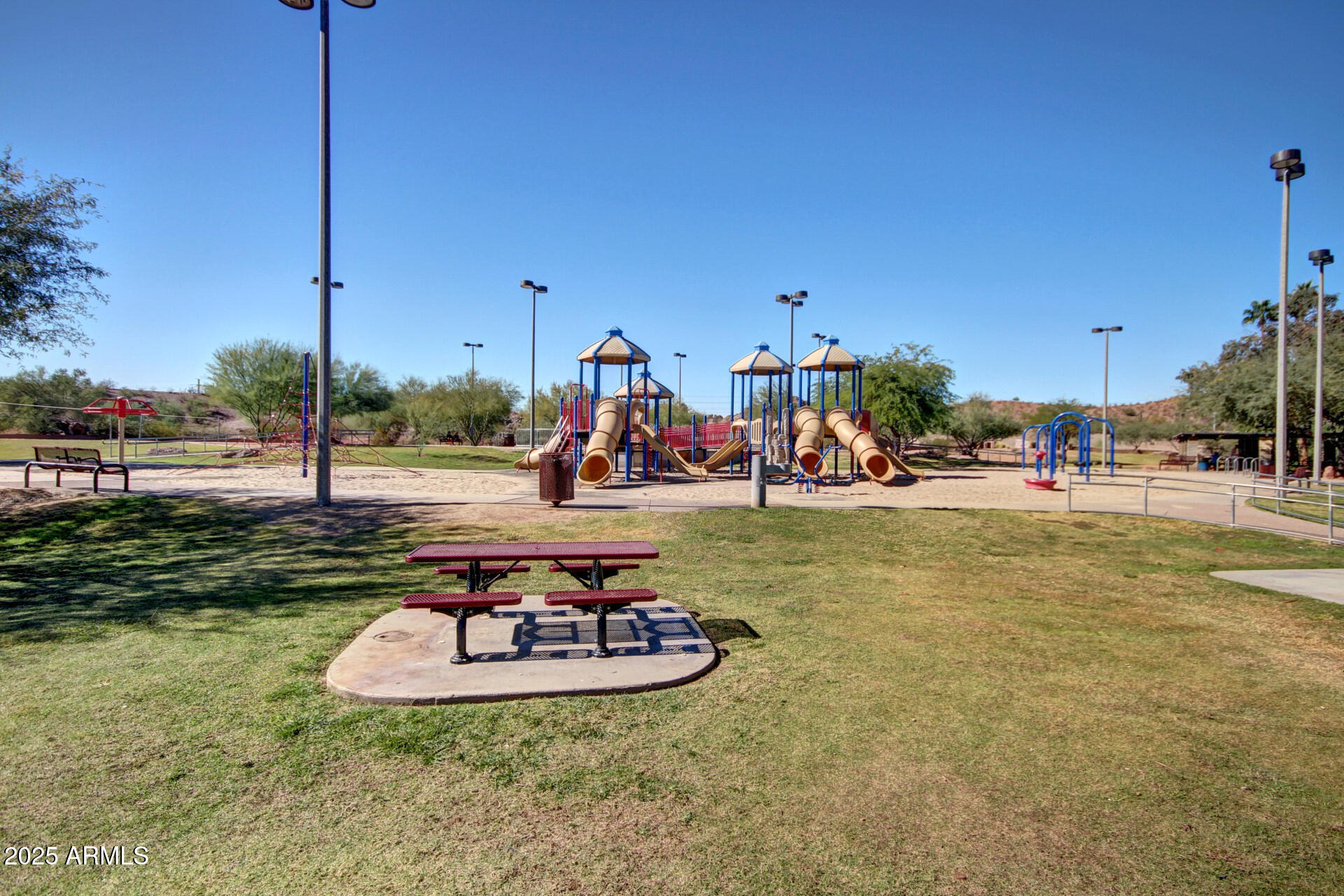 609 East Mesquite Circle, Unit D131 Tempe, AZ 85288 - Photo 24 of 39 a view of a swimming pool with a lawn chairs