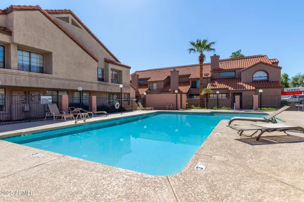 a view of a house with swimming pool