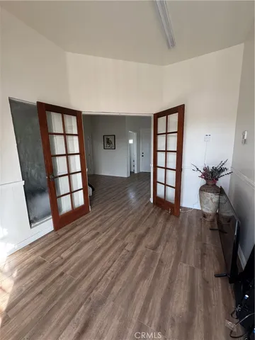 a view of a livingroom with furniture and wooden floor