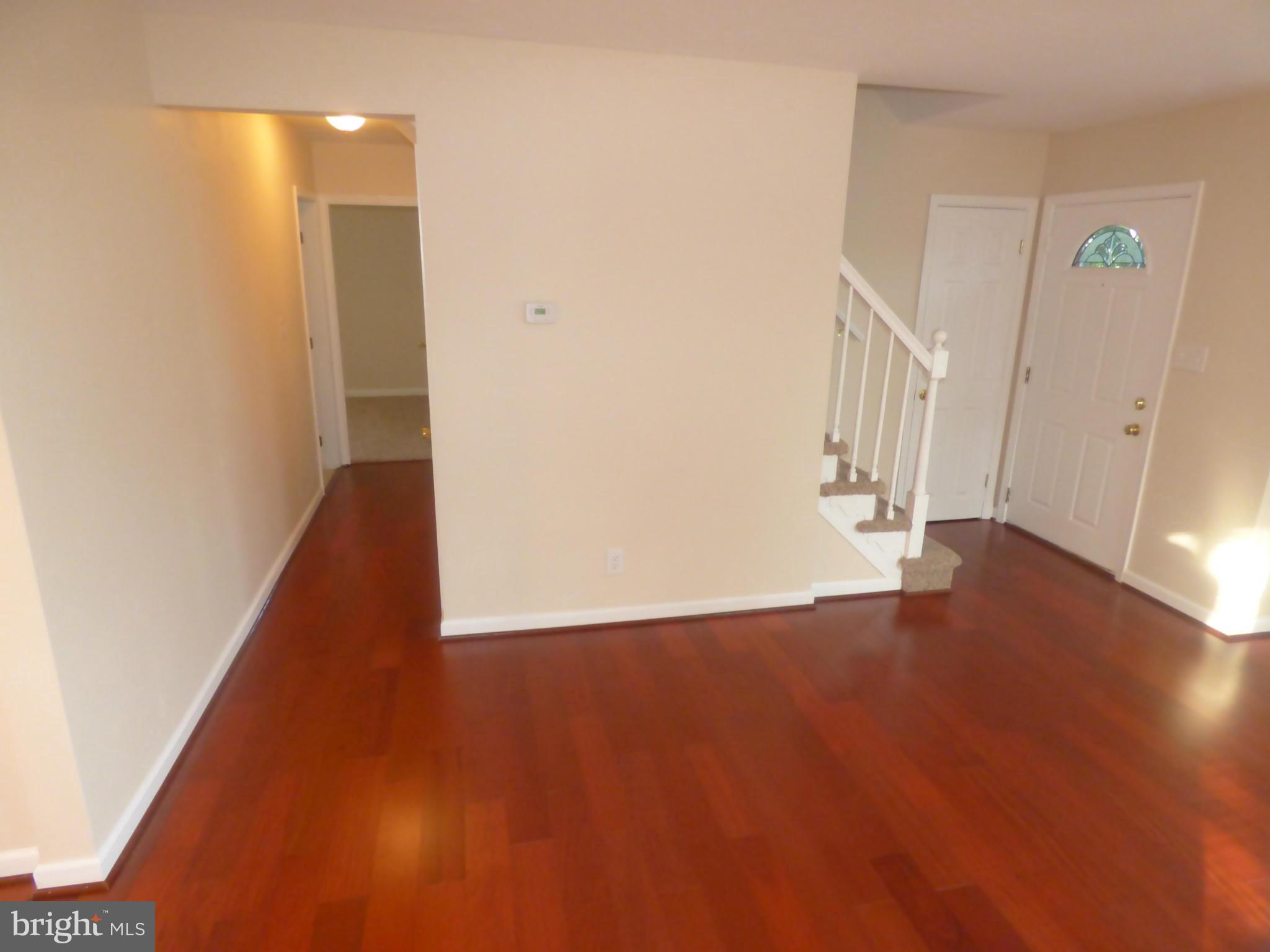 3405 Mayfair Road Baltimore, MD 21207 - Photo 3 of 27 a view of an empty room with wooden floor