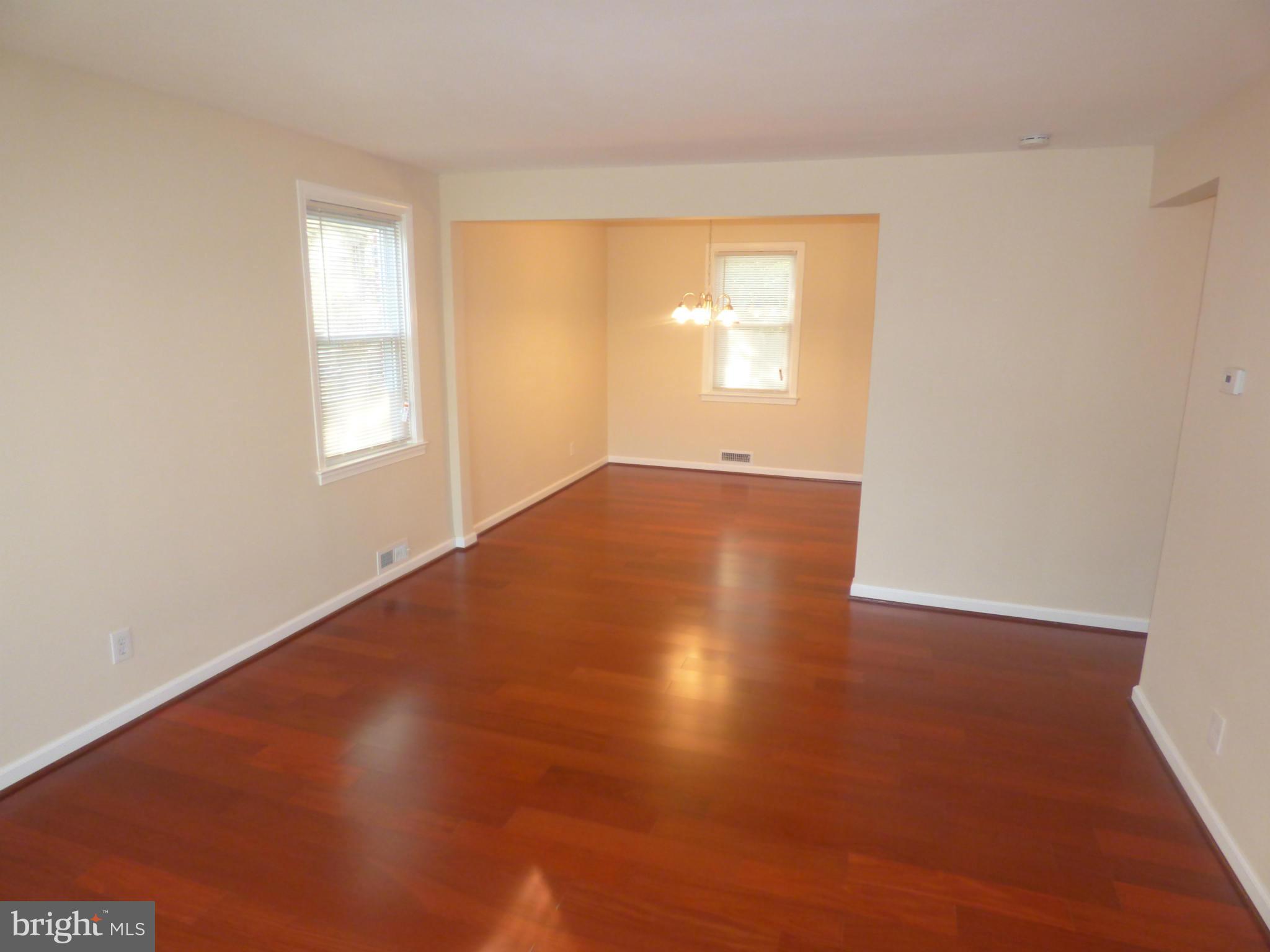 3405 Mayfair Road Baltimore, MD 21207 - Photo 4 of 27 an empty room with windows