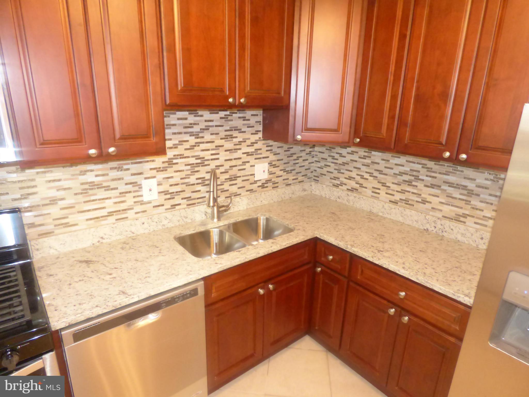 3405 Mayfair Road Baltimore, MD 21207 - Photo 10 of 27 a kitchen with a sink and cabinets