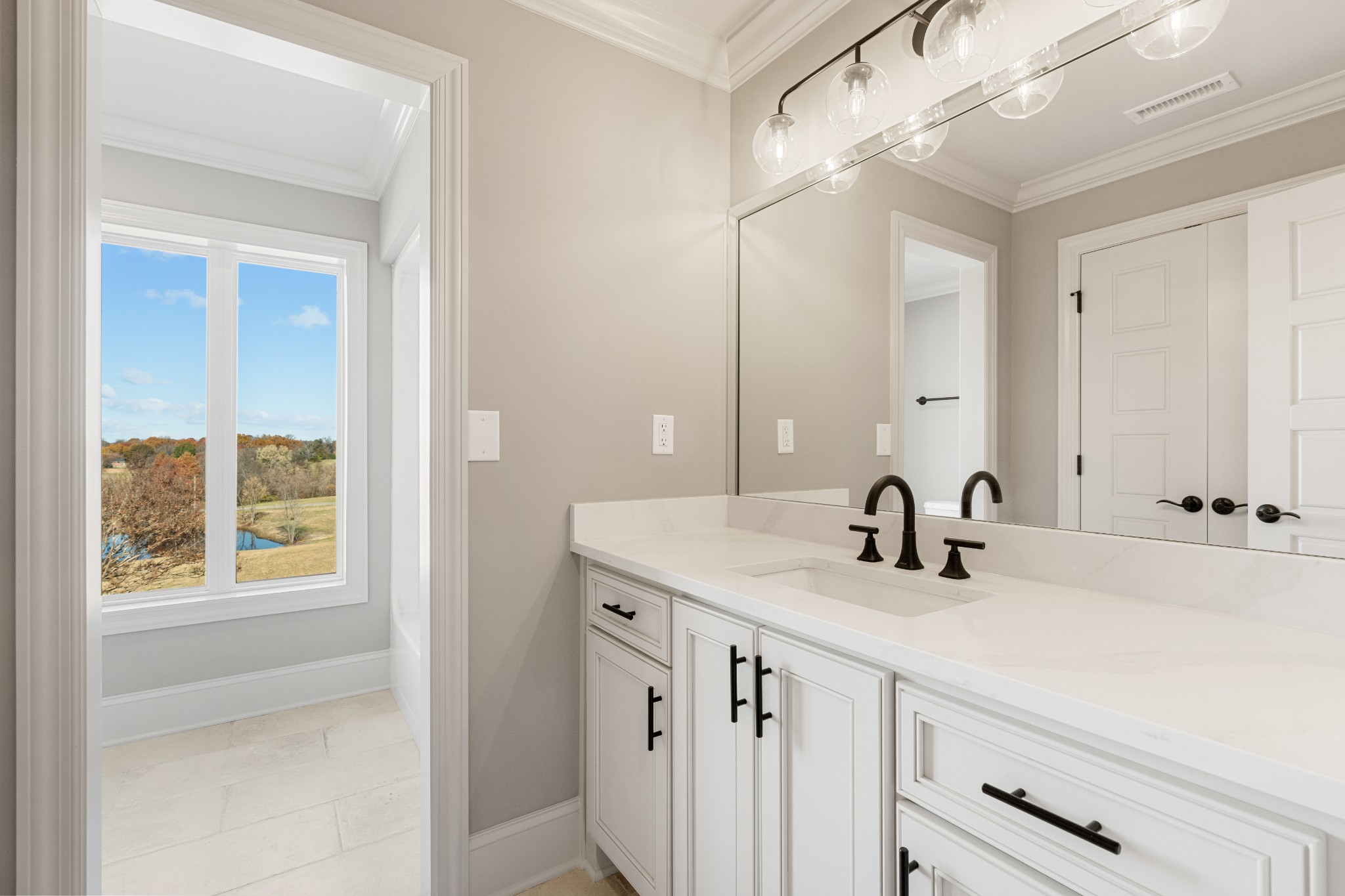 4818 Hickory Ridge Road Lebanon, TN 37087 - Photo 55 of 73 a bathroom with a sink and a mirror