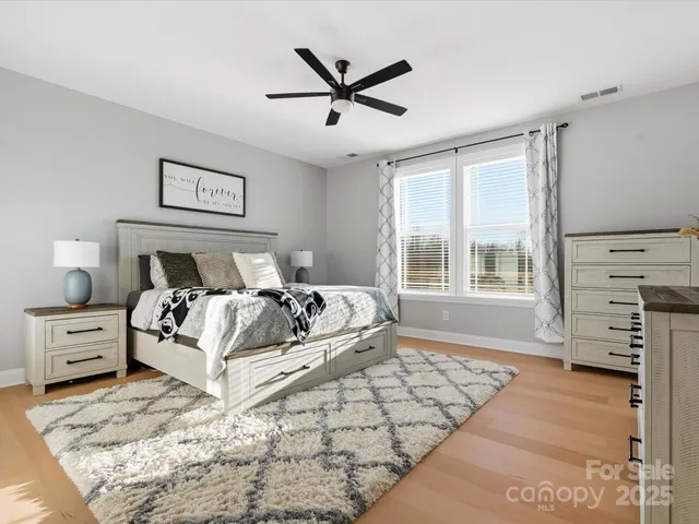 a bed room with a bed and a window