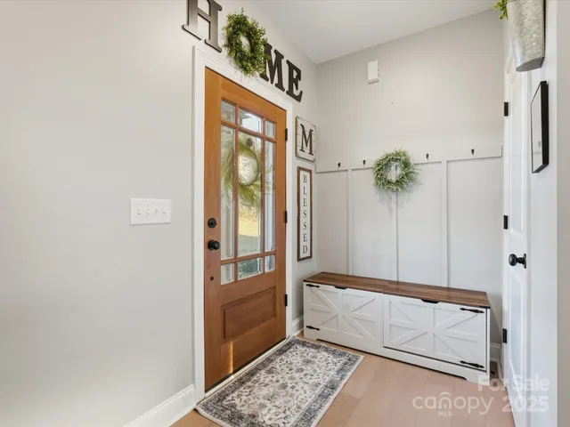 a bathroom with a tub shower and mirror