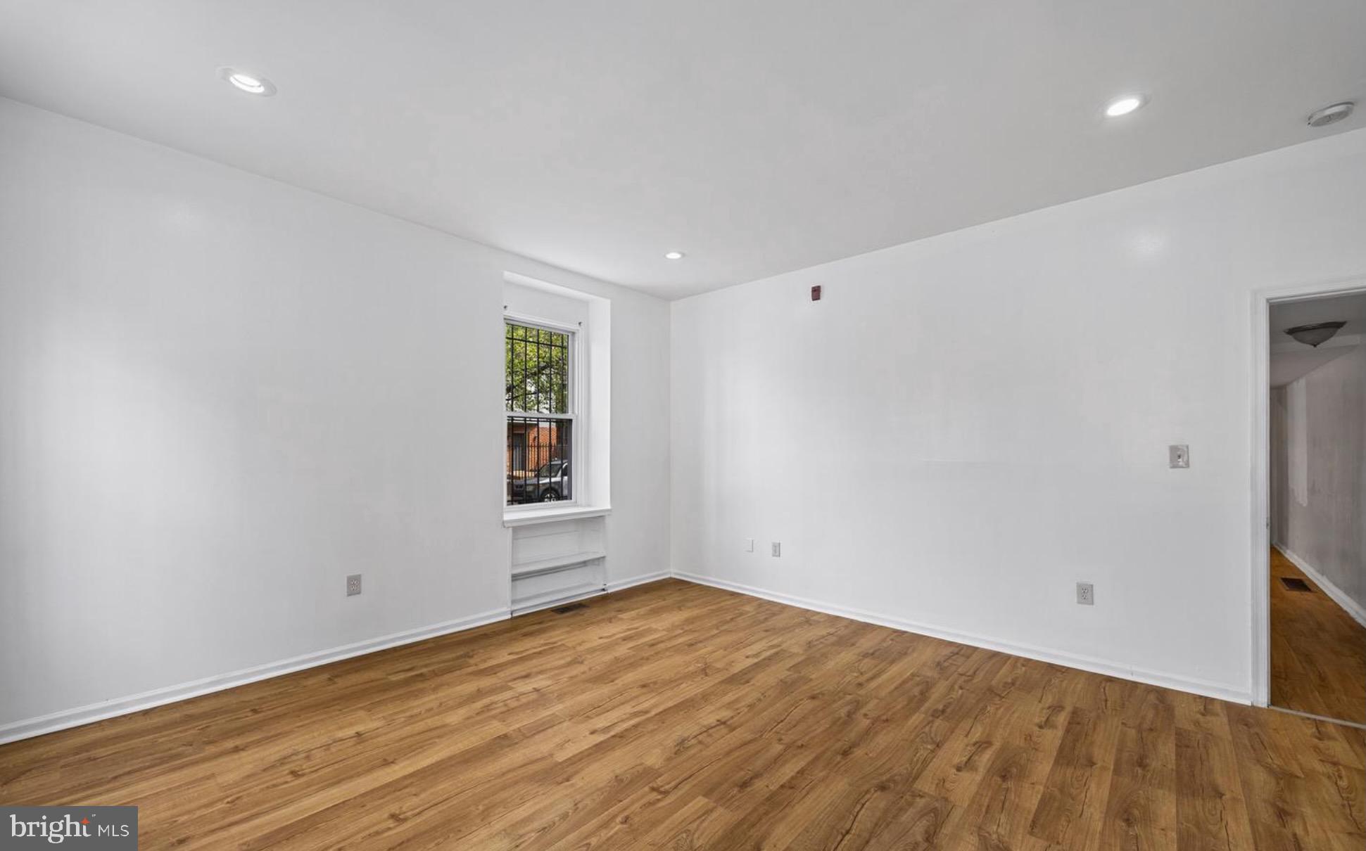 3800 Spring Garden Street, Unit 1 Philadelphia, PA 19104 - Photo 8 of 10 a view of empty room with wooden floor and fan