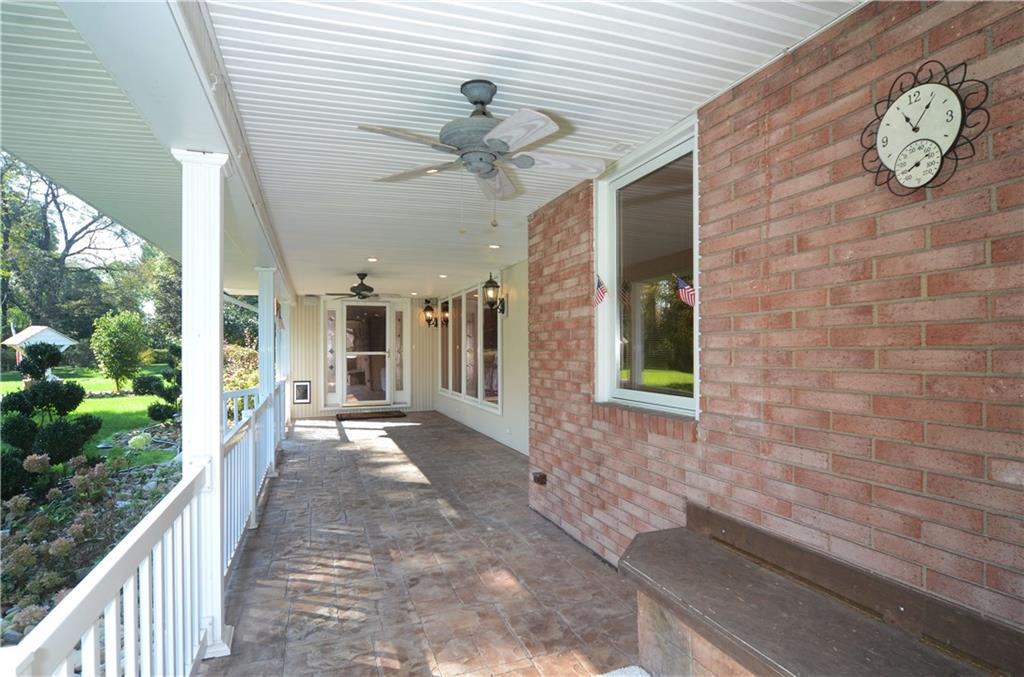 655 Bradys Ridge Road Beaver, PA 15009 - Photo 2 of 25 Front porch w/ ceiling fans, built in speakers, timer outlets for holiday lights.