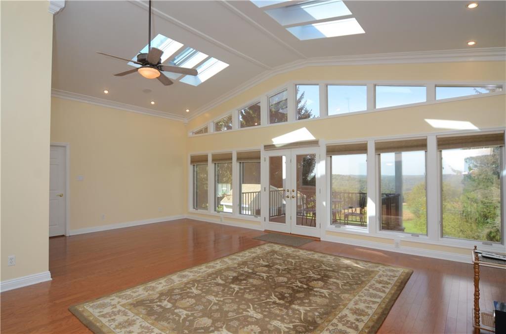 655 Bradys Ridge Road Beaver, PA 15009 - Photo 3 of 25 Huge family room with picturesque views. Hardwood floors, cathedral ceilings w/ remote skylights, newly added patio w/ pergola.