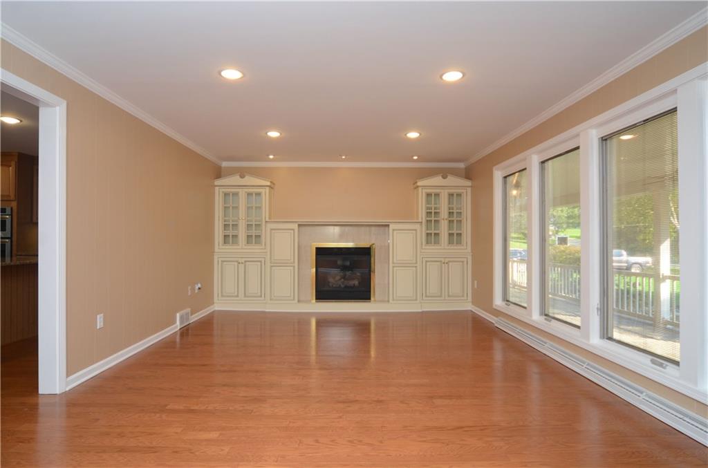655 Bradys Ridge Road Beaver, PA 15009 - Photo 9 of 25 Relax by the fireplace in the spacious living room.