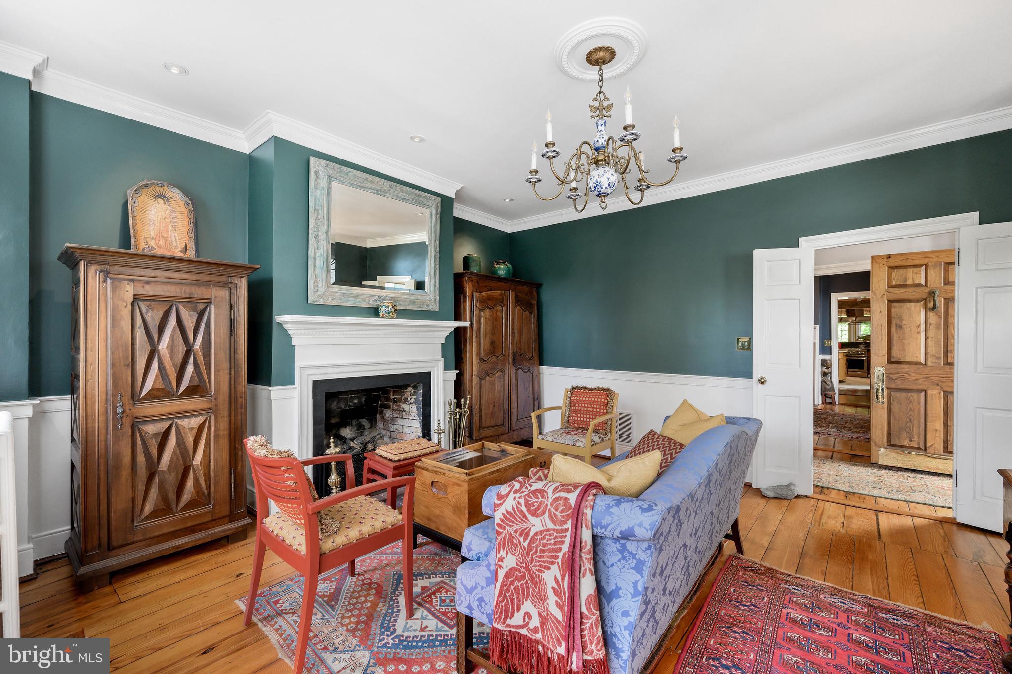 511 Queen Street Alexandria, VA 22314 - Photo 11 of 58 a view of a dining room with furniture wooden floor fireplace and a chandelier
